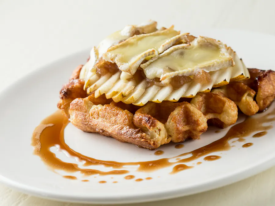 Liège waffle layered with thin slices of organic Fuji apple and melted havarti, drizzled with maple syrup